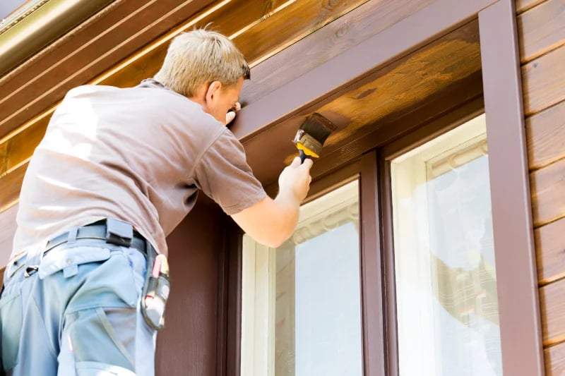 Man painting over mold, which can lead to many health issues.