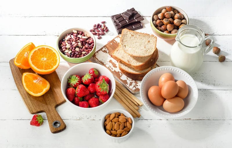 Flat lay of grains, fruits, nuts, etc, which help decrease overall inflammtion.